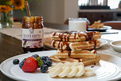 Datehini spread on waffles with fruit
